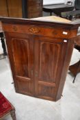 A 19th Century mahogany corner wall cupboard