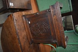 A traditional oak cabinet repurposed from clock hood