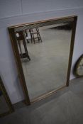 A modern gilt framed wall mirror