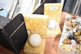 A pair of Art Deco era Onyx book ends with ball decoration.