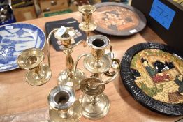 A traditional candelabra candlestick with a similar stick AF