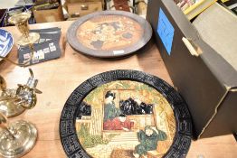 Four mid century oriental style Bretby wall plaques.