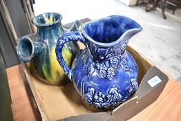 A vintage Arthur Wood Willie brewed a peck o'maut jug and a Dutch tulip style vase