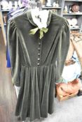 A collectable late 1970s Gina Fratini dark green velvet dress, having self covered buttons to