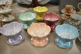Six Beswick crocus shaped lustre finish footed bowls.