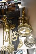 A mixed lot of brass toasting forks, candlesticks, horse brasses and more.