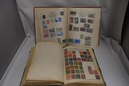 Two pairs of early 20th century philatelic stamp collectors albums