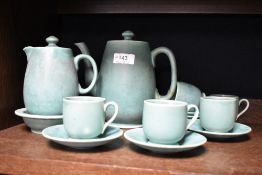 An early 20th century Moorcroft green glaze part tea service, teapot having damage to handle