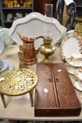 An early 20th century oil lamp with glass chimney, trivet, candlesticks, and a wooden box having two