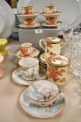 A Japanese partial coffee set having russet leaf pattern with gilt detailing, also included are