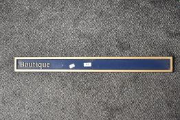 A modern wall sign for Boutique