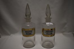 Two early 20th century Chemist or Apothecary glass bottles with labels