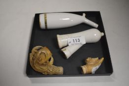 Two antique opium pipe bowls and two similar tobacco pipe bowls