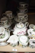 A collection of Portmeirion 'The Botanic Garden' cups and saucers, teapot and similar.