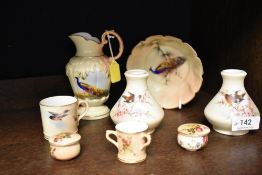 A selection of fine Royal Worcester ceramics including miniature love cup, song bird decorated