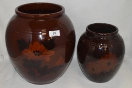 Two antique vase both having deep brown glaze with hand painted scenes of flowers