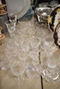 A mixed lot of vintage cut glass and crystal, including etched champagne glasses, tumblers and