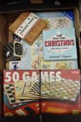 A box of jigsaws and games.