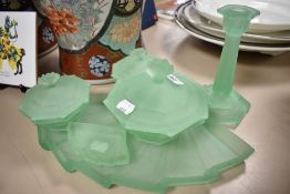 An Art Deco green glass dressing table set.