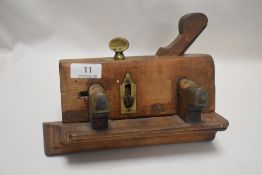 A Victorian beech wood moulding plane dated 1858 bearing makers name to brass plate and later names