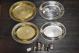 A small selection of silver plated wares including serving dishes, bells and telescopic stirrup cup