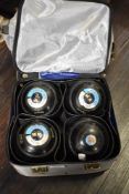 A set of Thomas Taylor Ligniod BIBC A98 crown green bowling balls in case