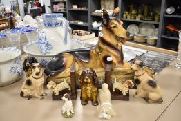 An Art Deco chalk ware German Shepard, A pair of cold painted terrier book ends, and an assortment