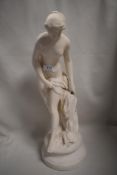 A vintage bisque glazed figure of a bathing maiden
