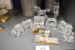 A modern Swarovski silver crystal glass study of a train set with Rocking Horse and Toy Soldier