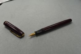 A Waterman W2 leverfill fountain pen in burgundy with single broad decorated band to the cap
