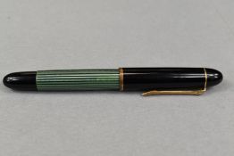 A Pelikan 140 piston fill fountain pen in green striated pattern and black cap having Pelikan 14ct
