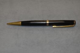 A waterman propelling pencil in black with gold trim