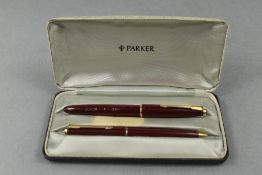 A Parker Duofold Junior Fountain pen and Propelling pencil set in red in original box