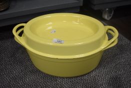 A Doufeu cast iron caserole dish in yellow enamel
