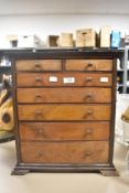 A miniature apprentice specimen chest of two over five graduated drawers with oak frontage