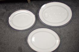 Three large Wedgwood platters, having blue rim and gilt motif detail, marked to underside with '