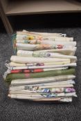 A box full of vintage and antique table linen, a lot being beautifully embroidered, including tray