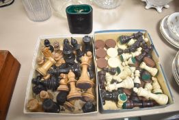 Two boxes of vintage chess pieces.