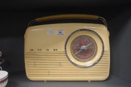 A mid century Bush radio in a cream and tan colour