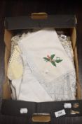 A selection of table linen, to include an antique deeply crotched table cloth, mats, and more.