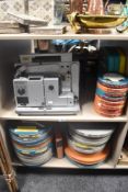 A Rank Aldis 16 mm film projector with a large amount of movie and cinema reels of Christian