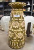 A mid century West German pottery vase Bay pat no 76 35 having daisy pattern with green glaze