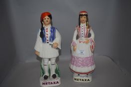 A pair of mid century Spanish Metaxa Greek ceramic decanters