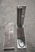 A boxed Sphygmomanometer.