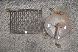 A antique stone grinder with label' The Carborundum Co, Niagra Falls.