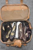 A suitcase containing a mixed lot of mens and womens vintage shoes.AF.