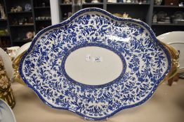 A large ceramic dinner tray with transfer print and gilt design