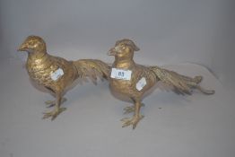 A pair of Victorian metal cast pheasant studies having a gilt finnish