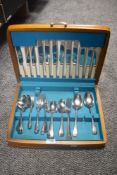 A Canteen of vintage stainless steel cutlery, including boned handled knives.