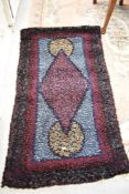 A traditional rag rug in vibrant colours